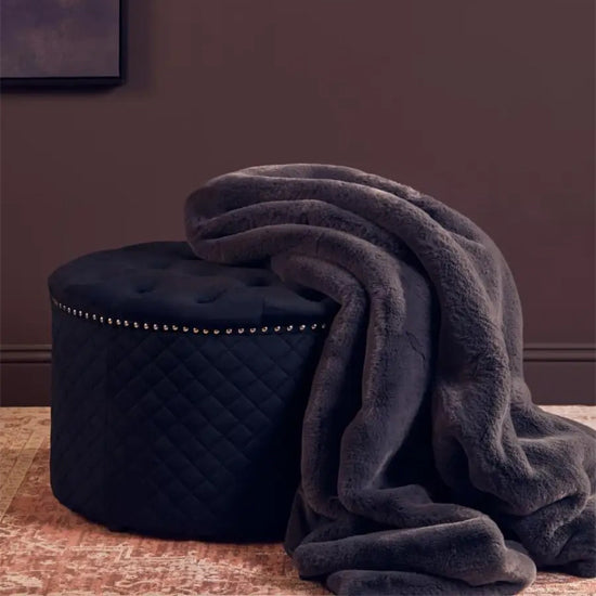 Zamora Round Velvet Ottoman In Black