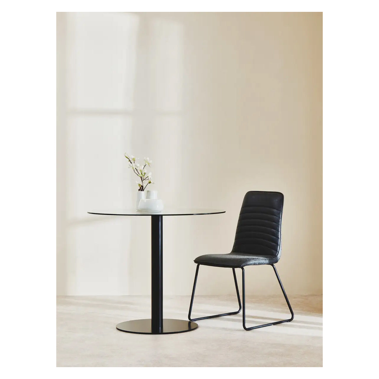 Metropolitan Round Clear Glass Dining Table With Matt Black Steel Base